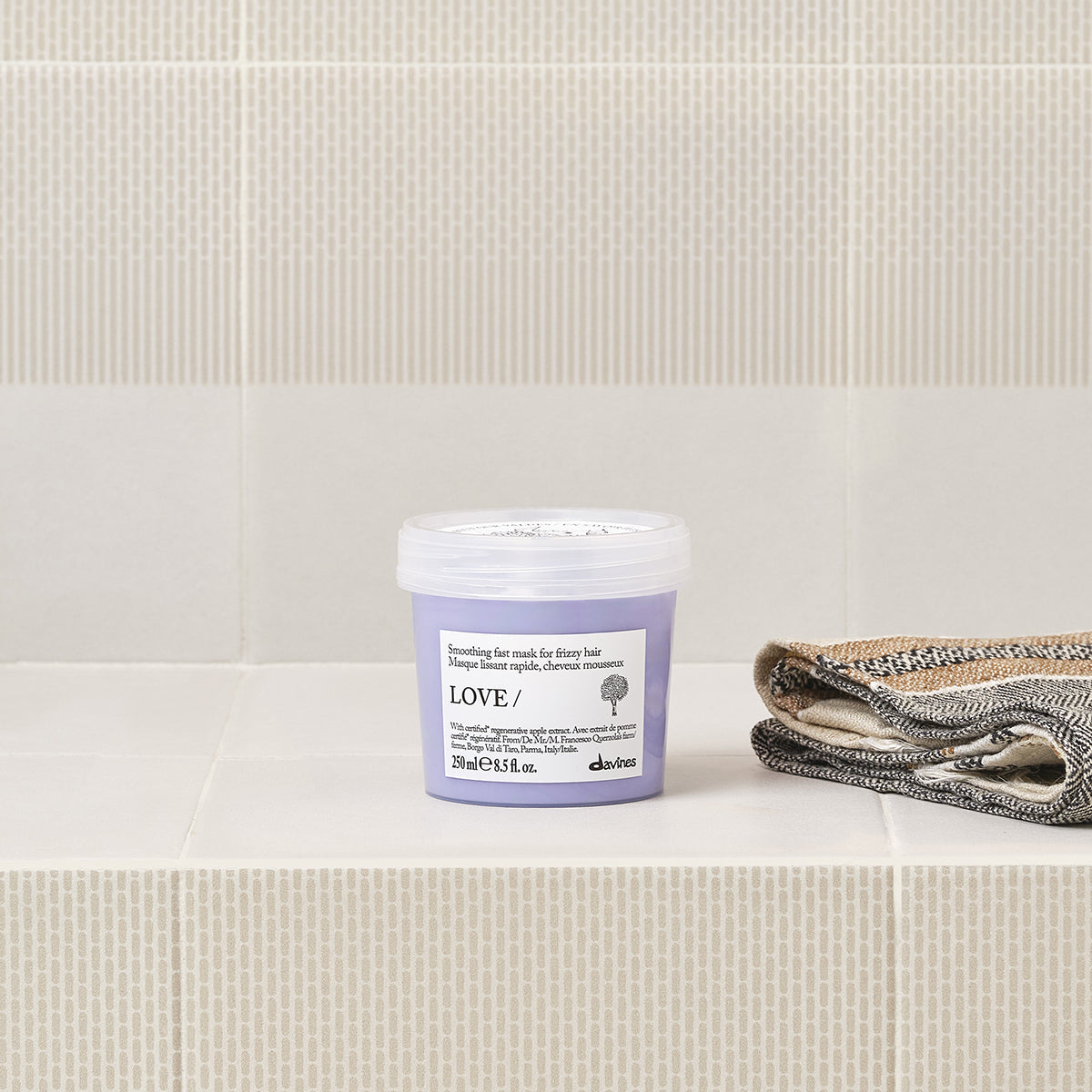 Lifestyle photo of Davines Love Smoothing Mask for frizzy hair