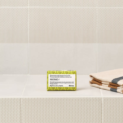 Lifestyle photo of Davines Momo Solid Shampoo bar for dry hair