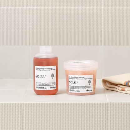 Lifestyle photo of Davines Solu Sea Salt Scrub, deep-cleansing scalp scrub