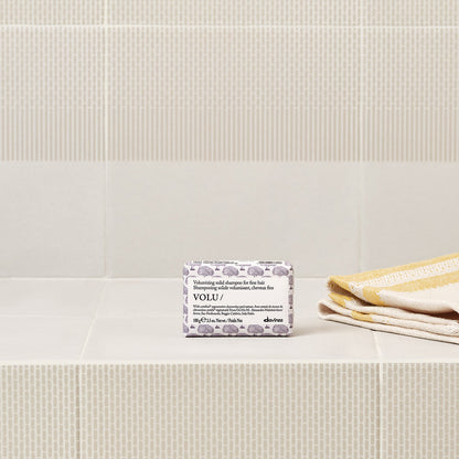 Lifestyle photo of Davines Volu Solid Shampoo bar for fine hair